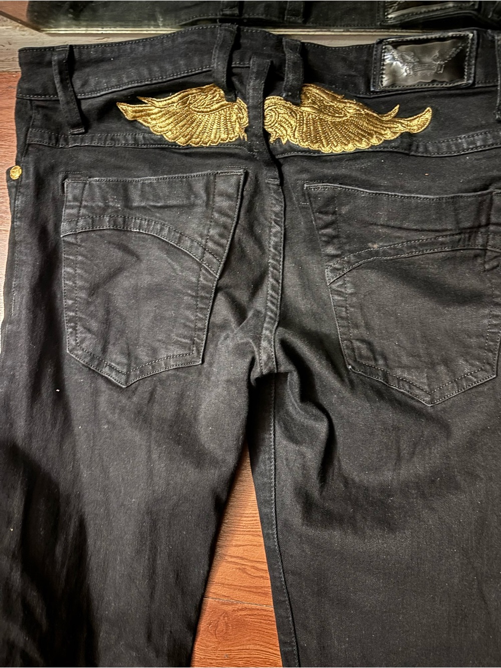 Robin's Jean Black Slim Straight Jeans with Gold Wing Embroidery